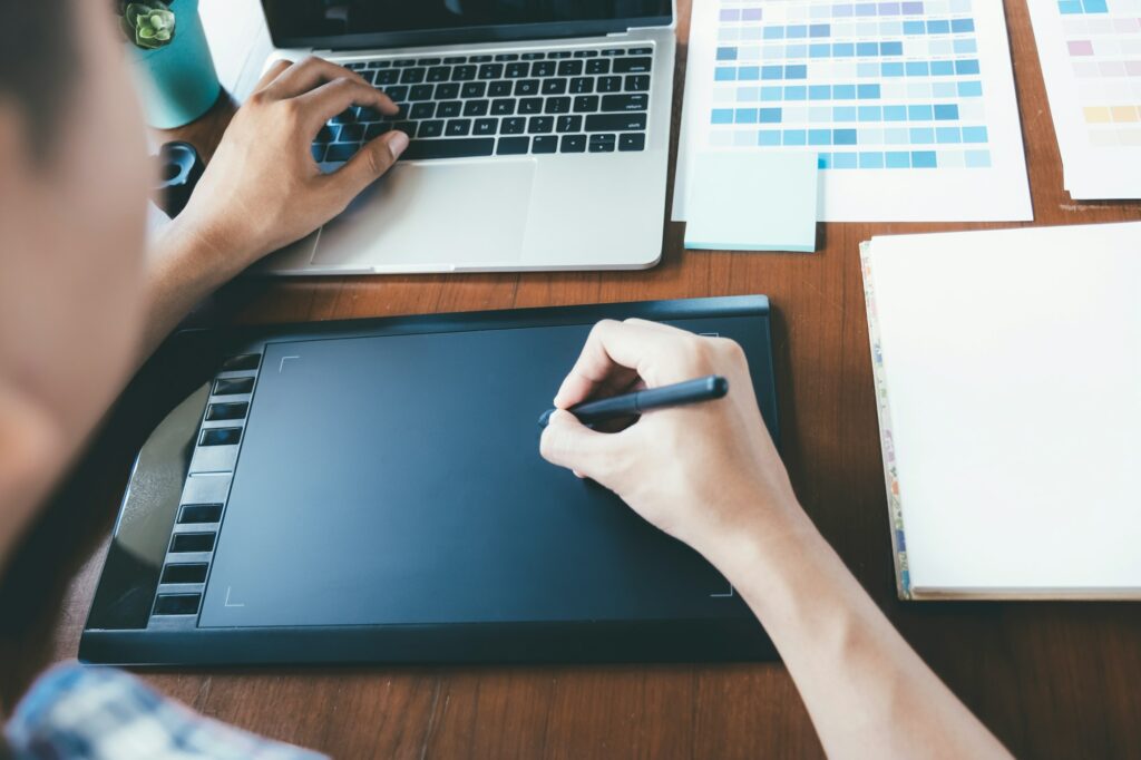 Graphic designer using digital tablet